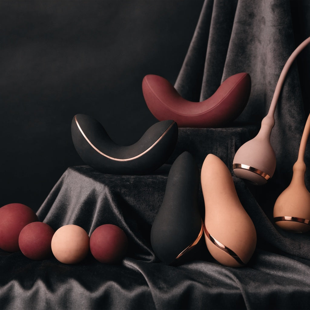 Premium Kegel toys and pelvic floor exercisers in black, burgundy and blush displayed on luxury black satin by Btantalized Australia.